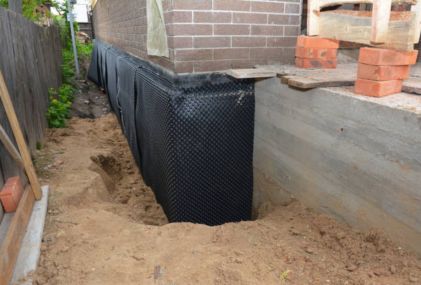 Happy homeowners after waterproofing job in Dunbridge